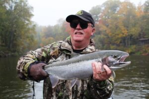 Mike from England, with the first fall steelhead of the annual outing on the Muskegon river.