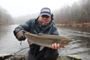 Paul D., from west Michigan, with a  foul weather Muskegon river steelhead caught recently.