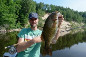 Adam with a Muskegon river Smallmouth bass