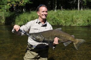 Dr. Carl, with a nice Pere Marquette river Chinook salmon caught on a recent outing.